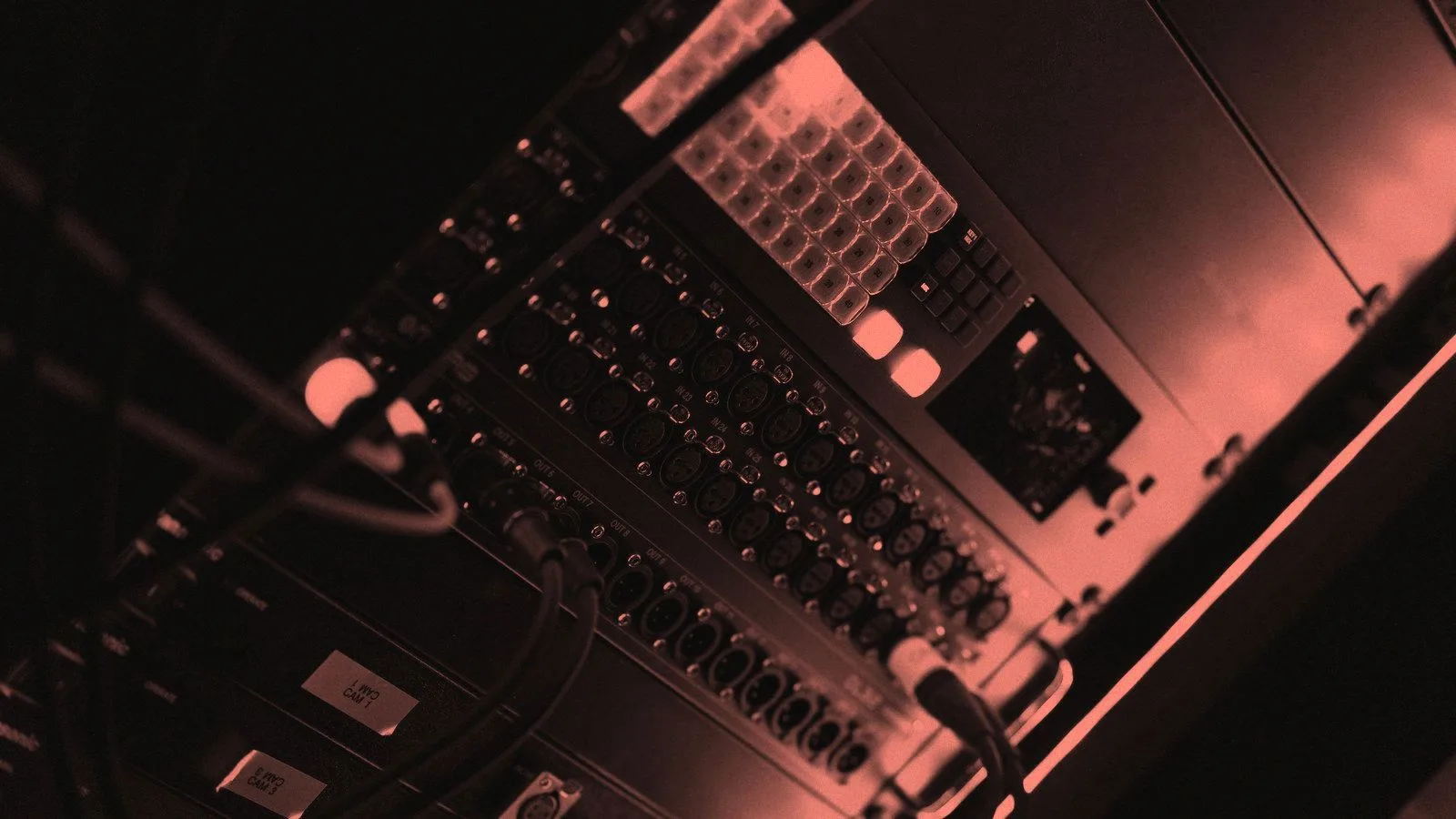 Close-up of server hardware and cabling in a dark rack